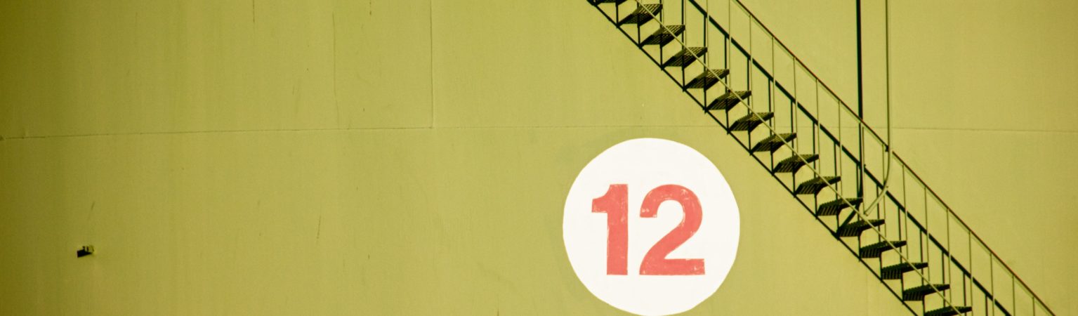 number 12 hanging on a wall