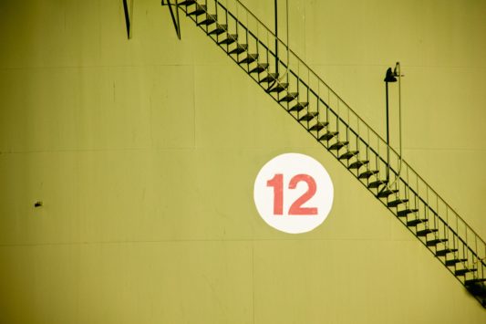 number 12 hanging on a wall