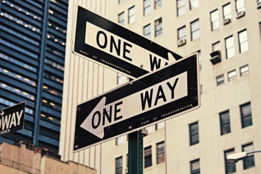 getting unstuck in your career with signs at a crossroads