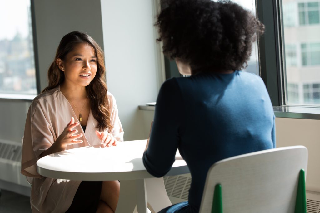 two people practicing communication in the workplace 