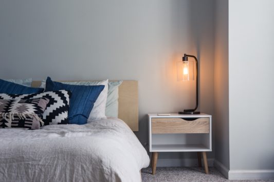 a lamp and a bed to help you think about your nightly routine