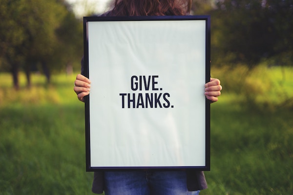 sign that says "give thanks" to remind you to be grateful in your nightly routine