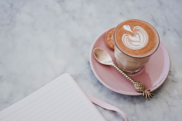 cup of coffee on pink plate