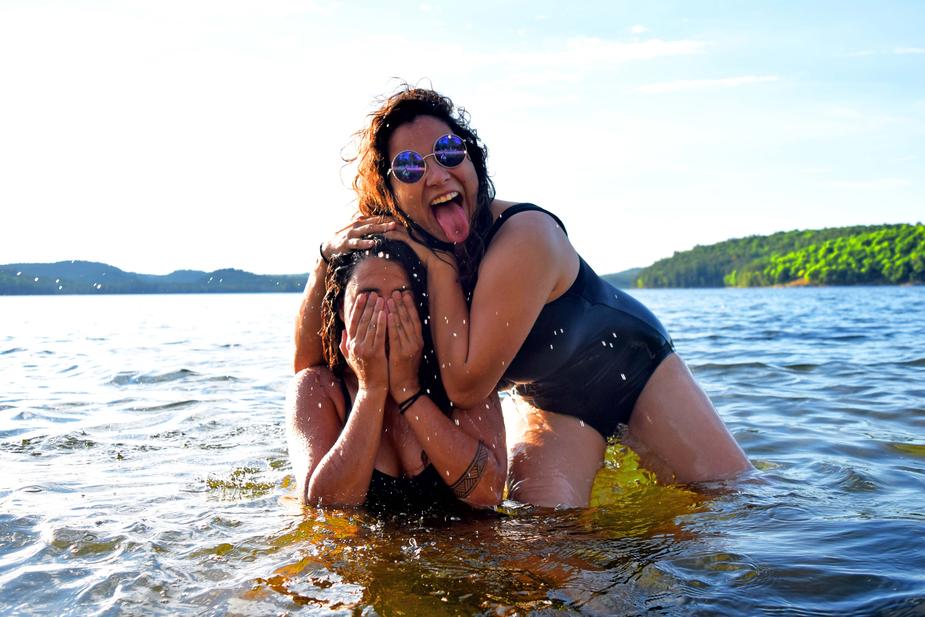 Two women having fun in a lake