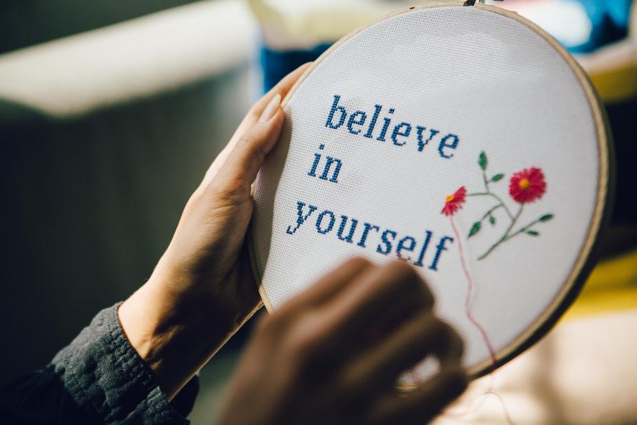 needlepoint that says "believe in yourself"