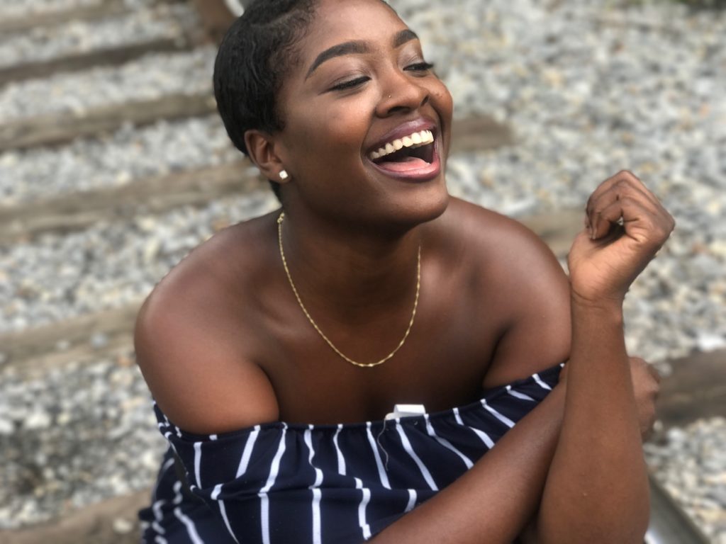 A woman laughing confidently