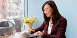 coach peggy working on the computer