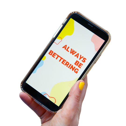 hand holding cell phone with "always be bettering" on the screen