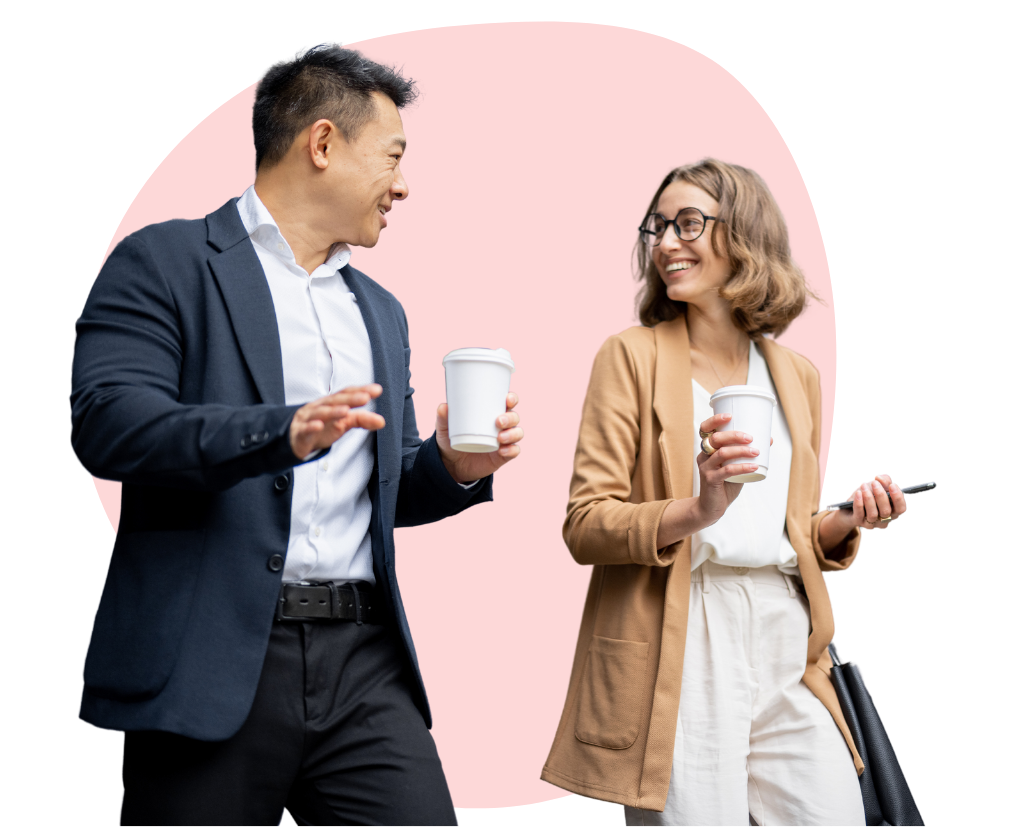 two people walking and talking at work with coffee cups