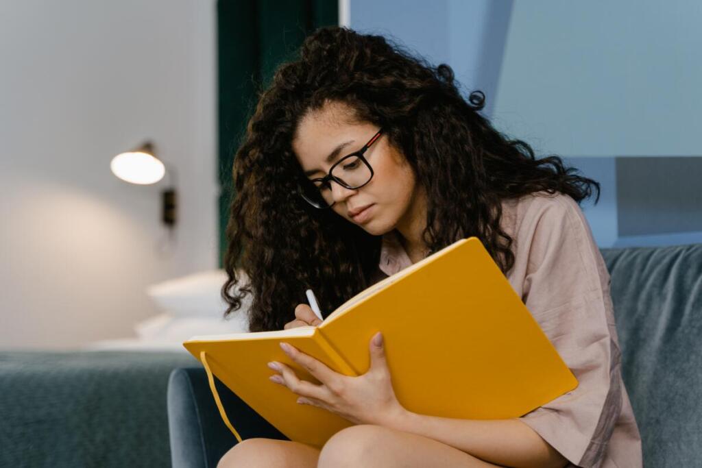 woman writing in planner