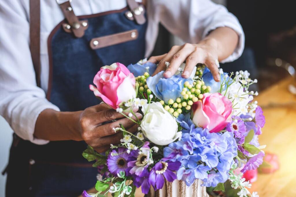 Woman working with flowers, close up