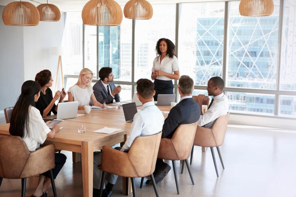 woman giving a presentation in front of colleagues