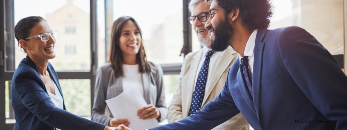 two professionals meeting and shaking hands. approach your networking strategy better by growing quality connections.