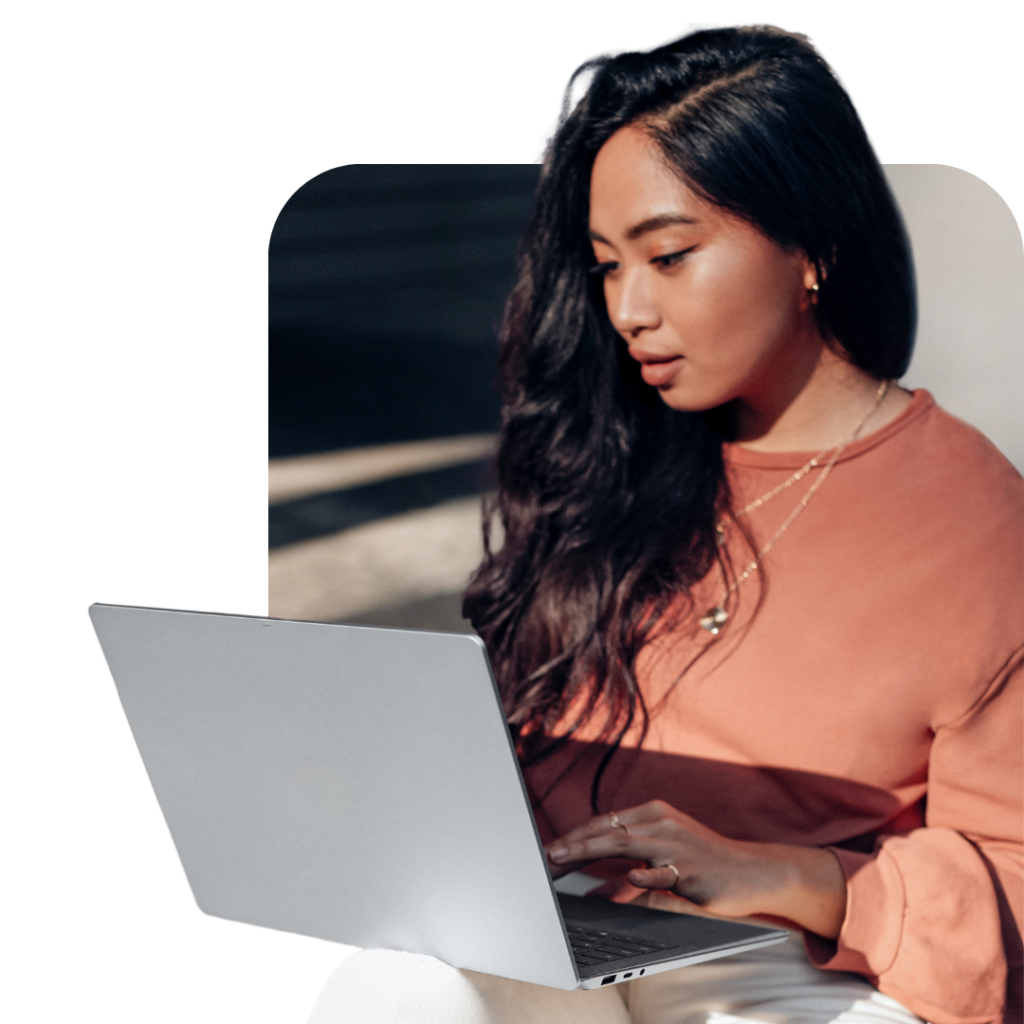 woman working on a laptop outside