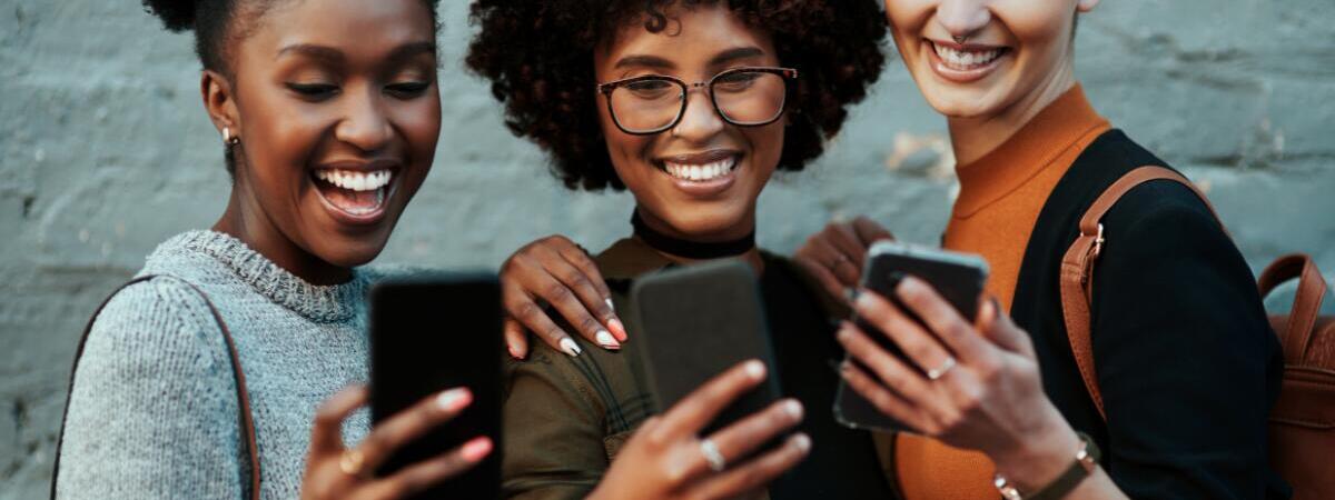 young professionals looking at their cell phones