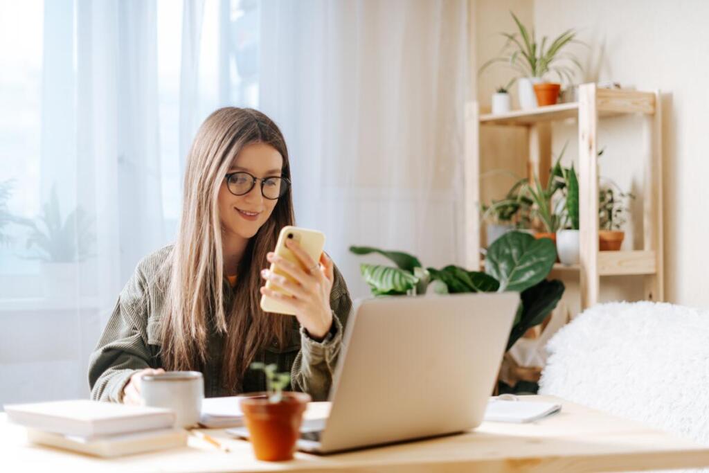 young woman looking at her cell phone