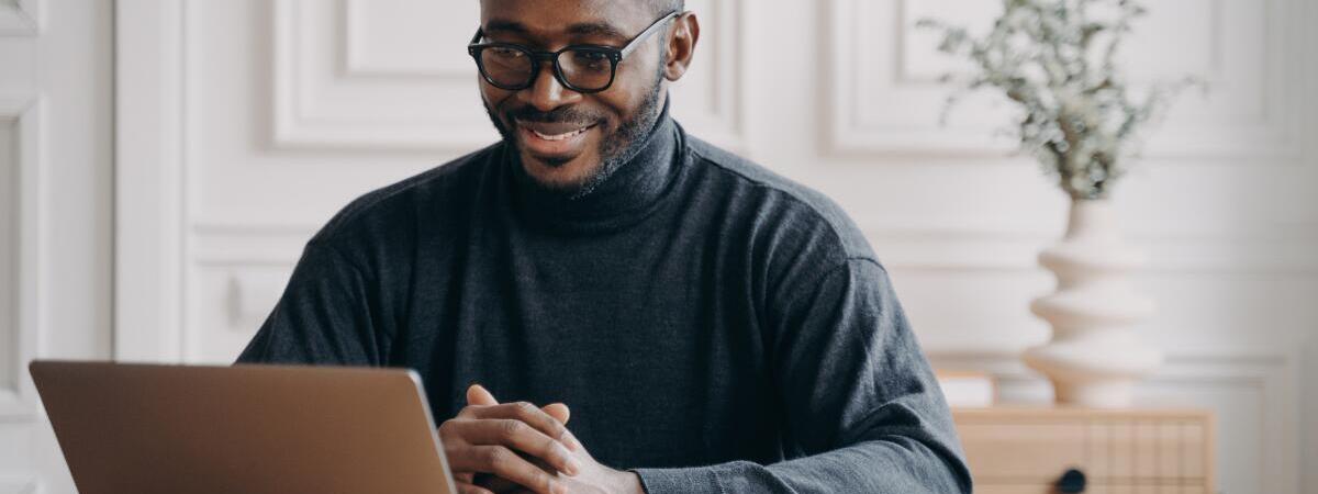 man on conference call on laptop