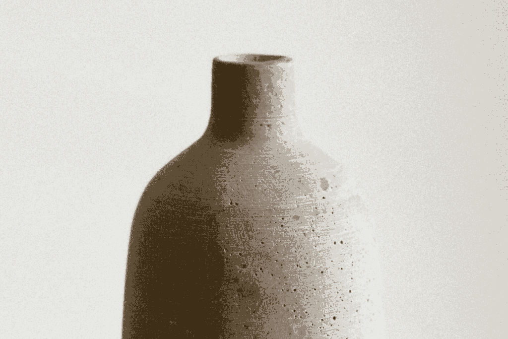 Ceramics Bottle Vase on tan background