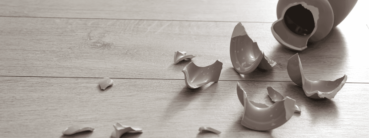 Broken ceramics vase on floor