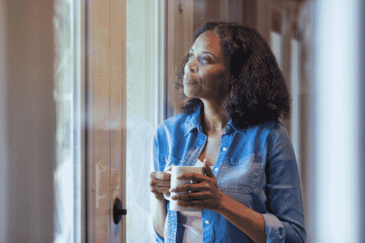 Woman reflecting on identity and purpose after retirement